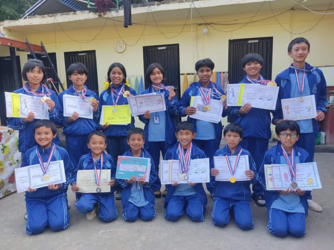 Volunteers helping children